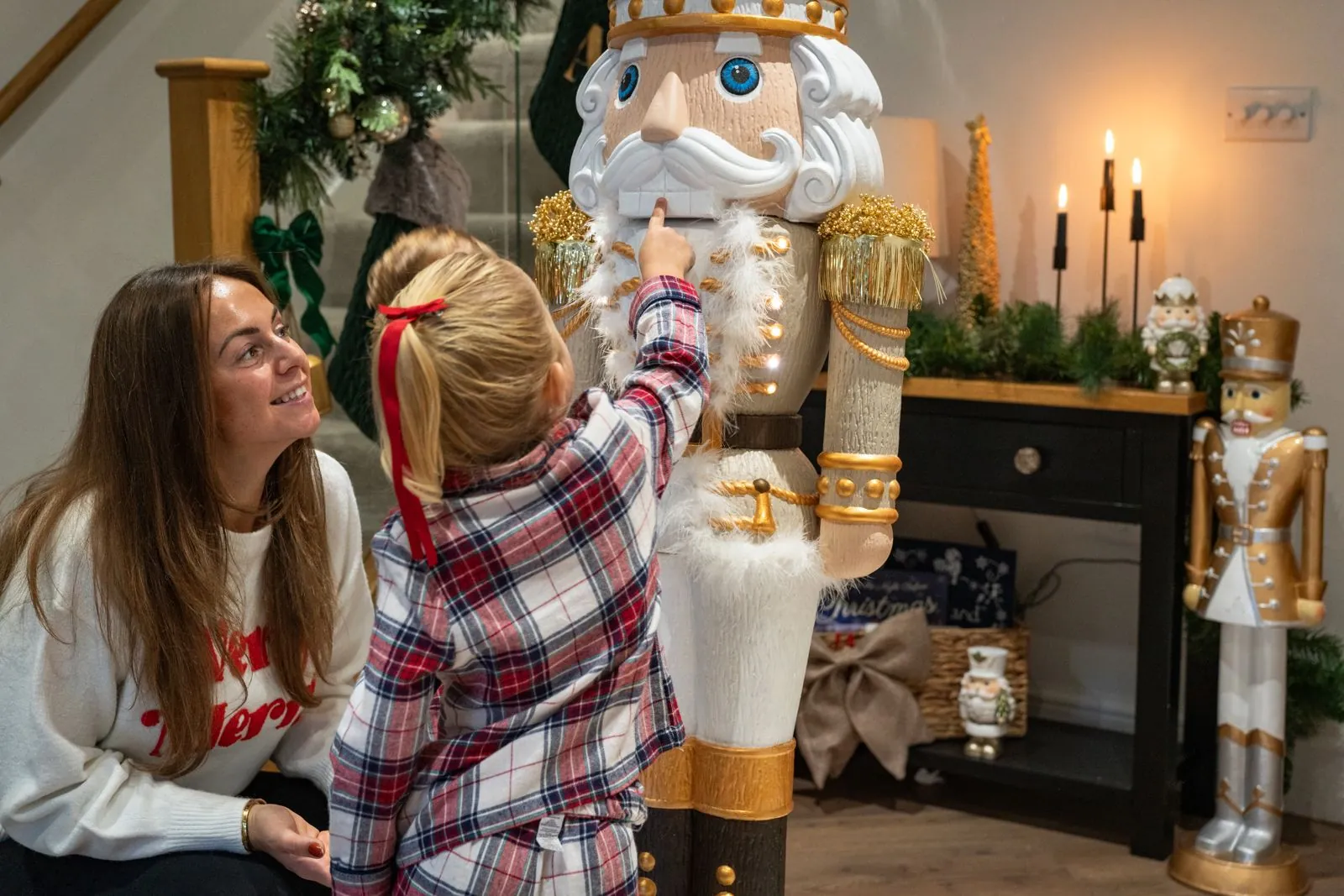 A finished hand-painted Otto in cream and gold, admired by a parent and child